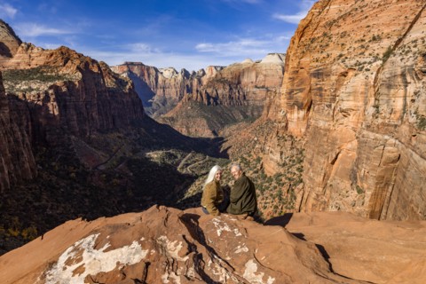 Portrait of senior couple looking at Zion Canyon from Zion Overlook, , Utah, USA