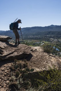 Usa, Colorado, Durango, Woman standing on ledge in San Juan Mountains, Durango, Colorado, USA