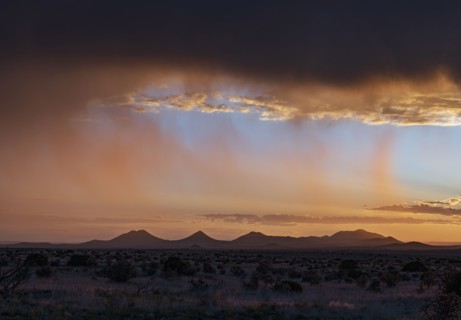 Usa, New Mexico, Santa Fe, Storm and rain over Cerrillos Hills at sunset, Santa Fe, New Mexico, USA