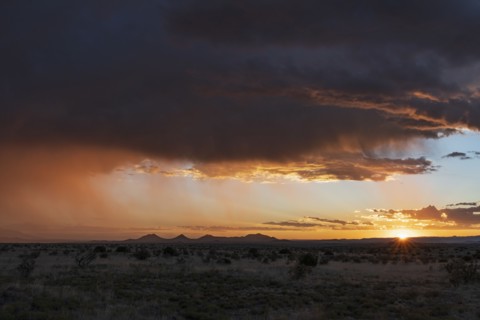 Usa, New Mexico, Santa Fe, Storm and rain over Cerrillos Hills at sunset, Santa Fe, New Mexico, USA