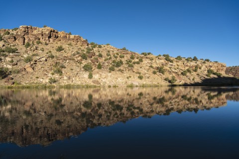 Usa, New Mexico, Abiquiu, Rio Chama, Hills reflected in Chama River, Abiquiu, New Mexico, USA
