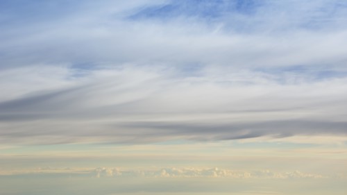 Layers of clouds from altitude 31,000 feet at sunrise, Miles City, Miles City, Florida, USA