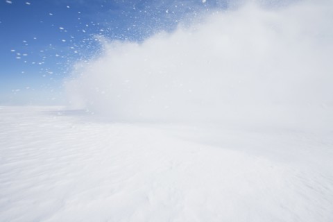 Blast of snow drifting blowing across frozen landscape, Hammond, NY, USA, Hammond, New York, USA