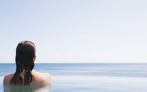 Woman in swimming pool, US Virgin Islands, USA, St. John, United States Virgin Islands, USA