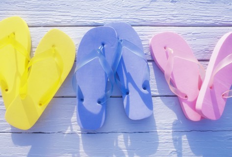 USA, Virgin Islands, St. John, Overhead view of colorful flip flops on deck, St. John, United