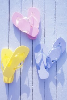 USA, Virgin Islands, St. John, Overhead view of colorful flip flops on deck, St. John, United