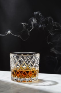 Smoke above glass of whiskey, New York, New York, USA