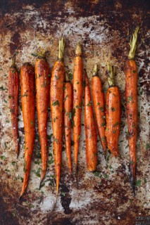 Overhead view of baked carrots on baking sheet, New York, New York, USA