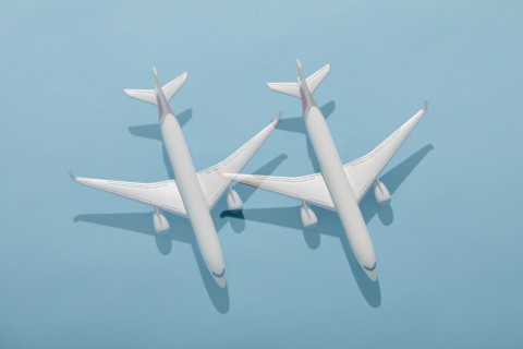 Overhead view of two model planes on blue background, New York, New York, USA
