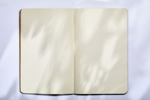 USA, New York State, New York City, Open note pad on white background, New York City, New York, USA