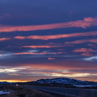 Pink sunset skies over ID-20 outside Mountain Home in snow, Mountain Home, Idaho, USA