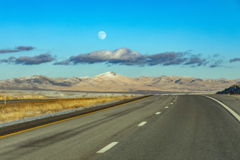 Moon and clouds over empty Interstate 80, Elko, Nevada, USA