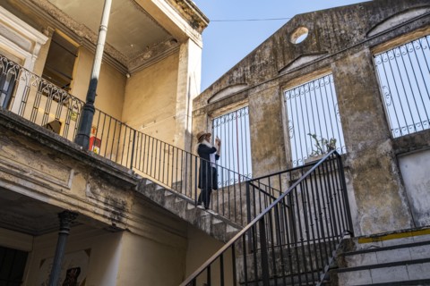 Woman photographing old buildings, Buenos Aires, , Argentina