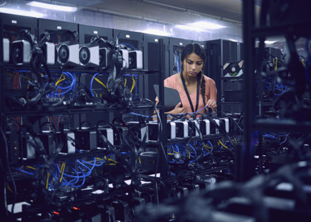 Female technician working in server room 
St, George, Utah, USA