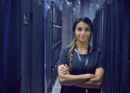 Portrait of smiling female technician in server room 
St, George, Utah, USA