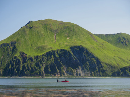Boat on Dutch Harbor near cliff
Unalaska, Dutch Harbour, Alaska, USA