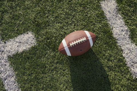 Overhead view of American football ball in field
New York City, NY USA