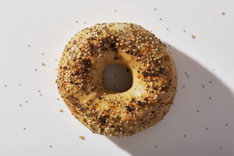 Overhead view of seeded bagel on white background
New York City, NY USA