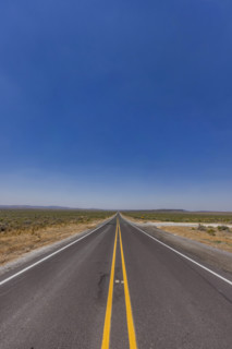 USA, Nevada, Ely, Empty highway in desert landscape
