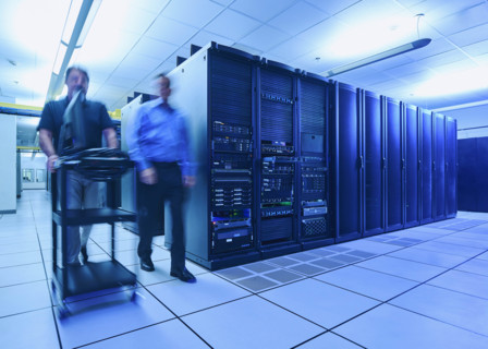 Two men walking in data center