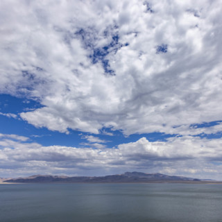 USA, Nevada, Henderson, White puffy clouds over calm Walker Lake