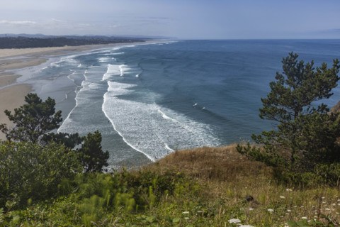 USA, Oregon, Newport, Sea waves washing empty beach