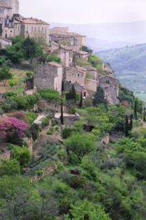 France, Gorde, Stone houses and trees on hillside
