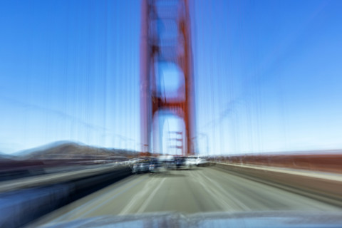 USA, California, San Francisco, Motion blur image driving across Golden Gate Bridge