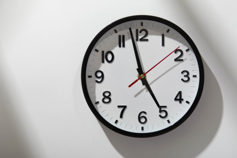 Wall clock on light streaked background