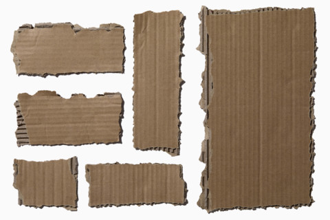 Pieces of torn cardboard on white background