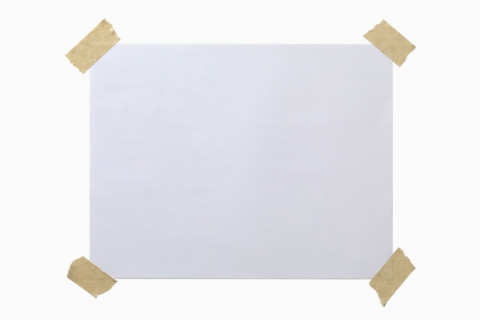 Blank paper taped to white background