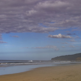 Costa Rica, Guanacaste, Playa Grande, Thick clouds over empty beach