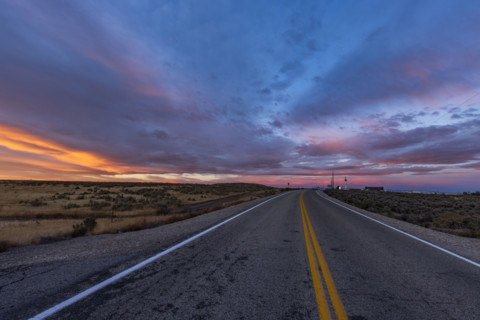 USA, Idaho, Boise, Dramatic sunrise sky above empty Interstate 84