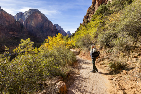 USA, Utah, Zion National Park, Portrait of smiling woman on Angels Landing Trail