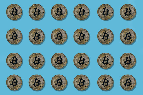 Multiple bitcoin on blue background