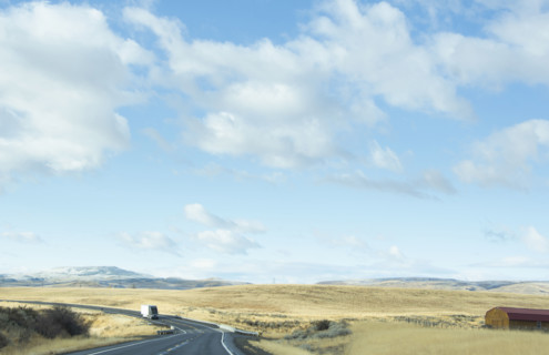 USA, Idaho, Single truck on highway in landscape