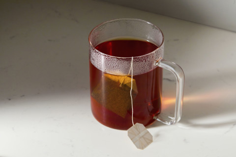 Cup of tea on kitchen counter. New York City, New York State, USA.