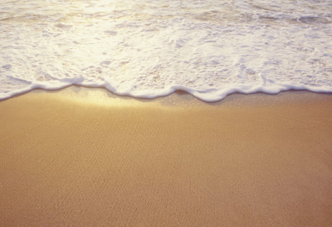 Close-up of sea wave washing sandy beach. Spring Lake, New Jersey, USA.