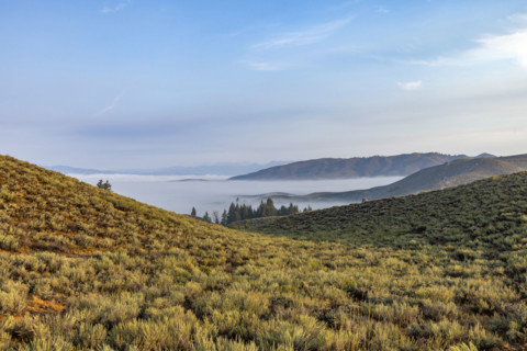 Fog over lowlands from Cat Creek Summit. Mountain Home, Idaho, USA.