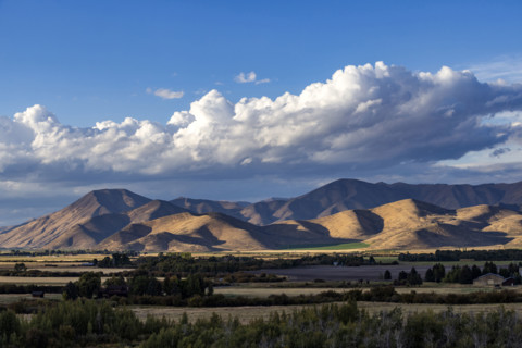 White puffy clouds over mountains. Bellevue, Idaho, USA.
