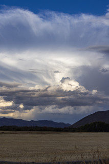 Storm clouds over field. Bellevue, Idaho, USA.