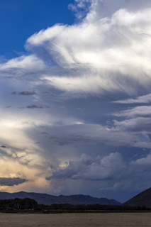 Dramatic clouds over mountains and field. Bellevue, Idaho, USA.