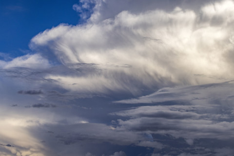 Dramatic white clouds in sunlight on blue sky. Bellevue, Idaho, USA.