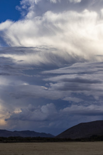 Dramatic clouds over mountains and field. Bellevue, Idaho, USA.