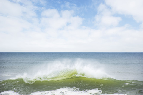 Ocean wave splashing on shore. Nantucket, Massachusetts, USA.