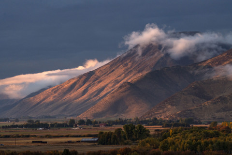Clouds covering hills in late afternoon light. Bellevue, Idaho, USA.