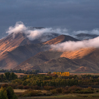 Clouds covering hills in late afternoon light. Bellevue, Idaho, USA.