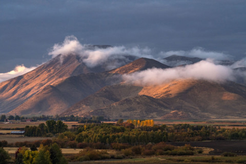 Clouds covering hills in late afternoon light. Bellevue, Idaho, USA.