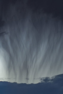 Heavy rain pouring from gray clouds. Bellevue, Idaho, USA.