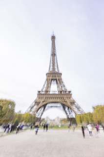 Tourists near Eiffel Tower, blurred motion. Paris, Ile de France, France.